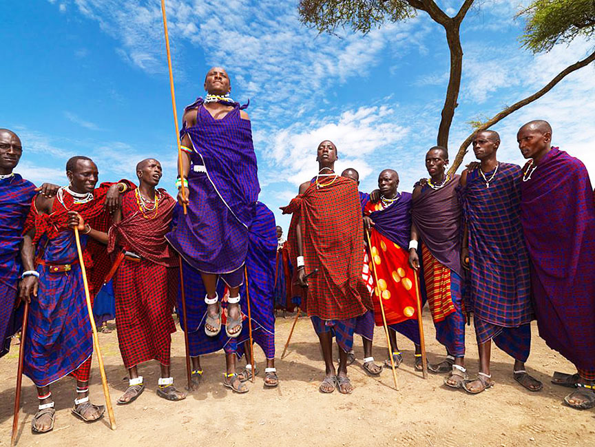 Masai tribe of warriors jumping with spears in Tanzania, Africa